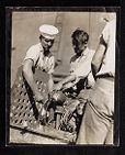 Various scenes of crewmen onboard and off ship  